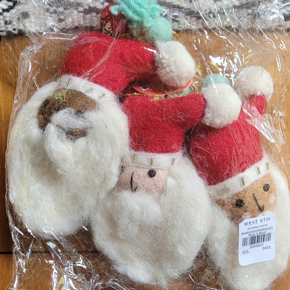 West Elm multi racial Santa wool ornaments